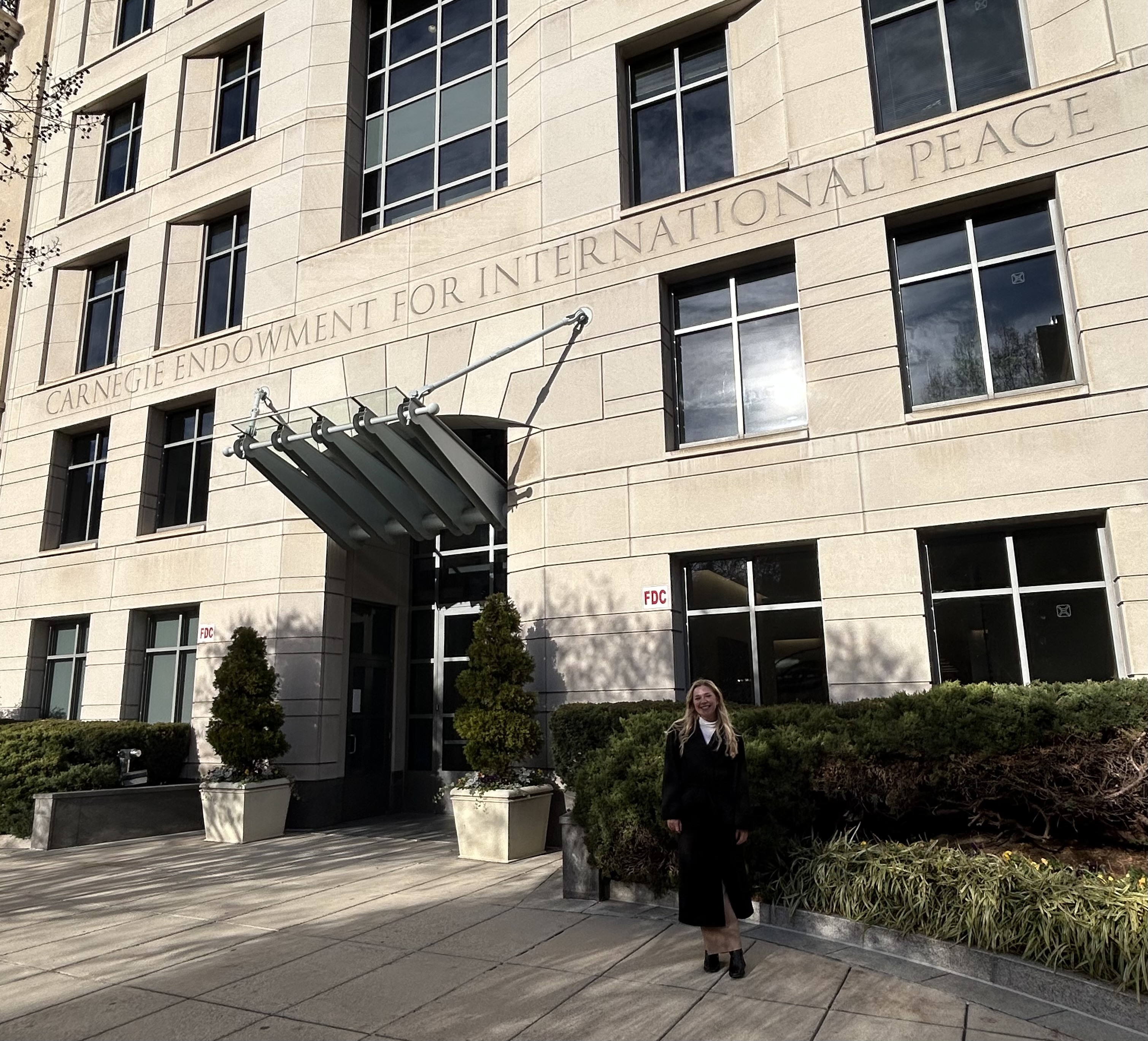 Caroline Mallory stands outside Carnegie Endowment for International Peace building in Washington, D.C.