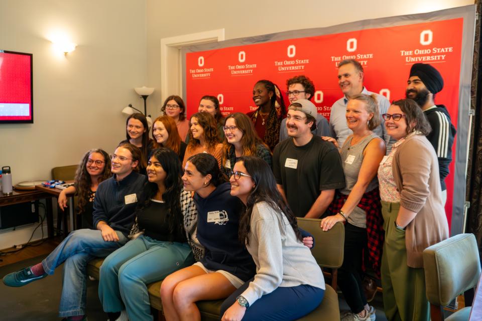 I hit submit fall 2024 group together in front of red ohio state backdrop